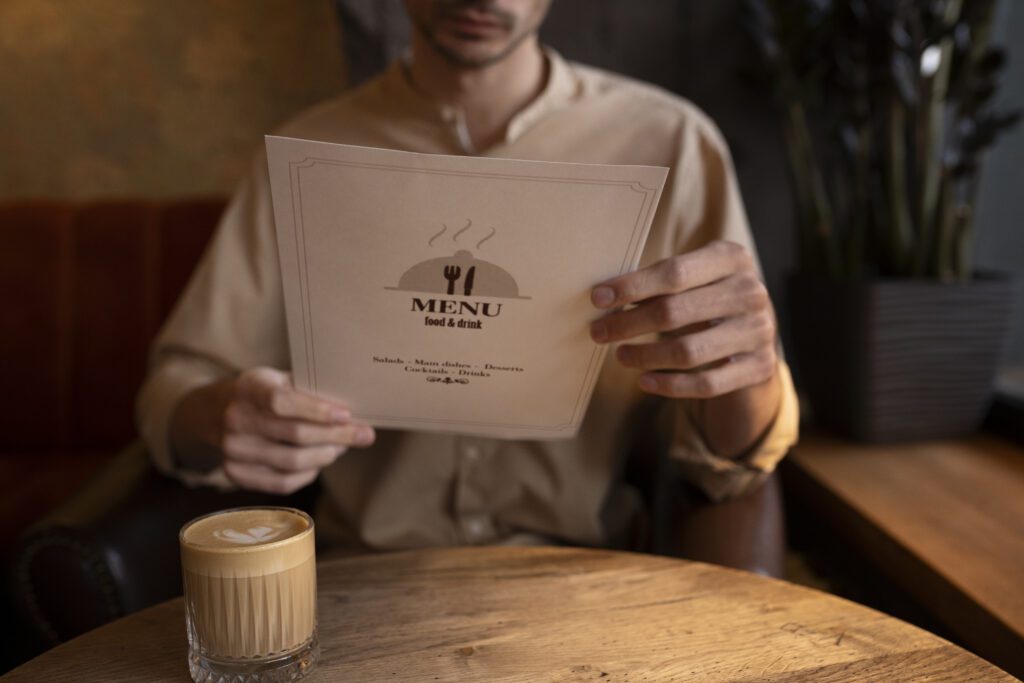 front view man holding menu scaled